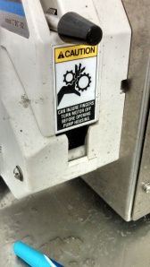 Warning sticker on the bottling machine.
